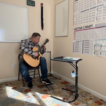 Syncope Music Studio - Student learning left hand position - Musical Instruments & Teachers Near Me - Trevose, Pennsylvania Syncope Music Studio - Student learning left hand position - Musical Instruments & Teachers Near Me - Trevose, Pennsylvania