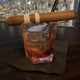 Davidoff cigar, an Old Fashioned, and chess.