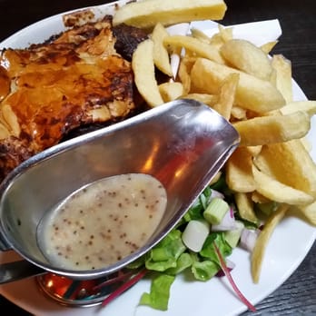 Jacob's Well - Dinner special: onion and meat (beef) pie with fries and a house salad - Pubs Near Me - Rathdrum, WW