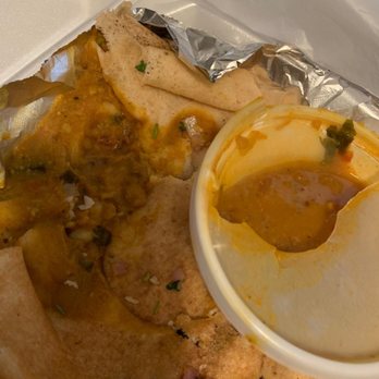 Curry In Hurry - Sambhar spilled on the dosa from the broken poor quality food container - Indian Near Me - Austin, Texas Curry In Hurry - Sambhar spilled on the dosa from the broken poor quality food container - Indian Near Me - Austin, Texas