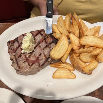 Johnny Carino's - 8 oz steak with potato wedges - Italian Near Me - Modesto, California Johnny Carino's - 8 oz steak with potato wedges - Italian Near Me - Modesto, California