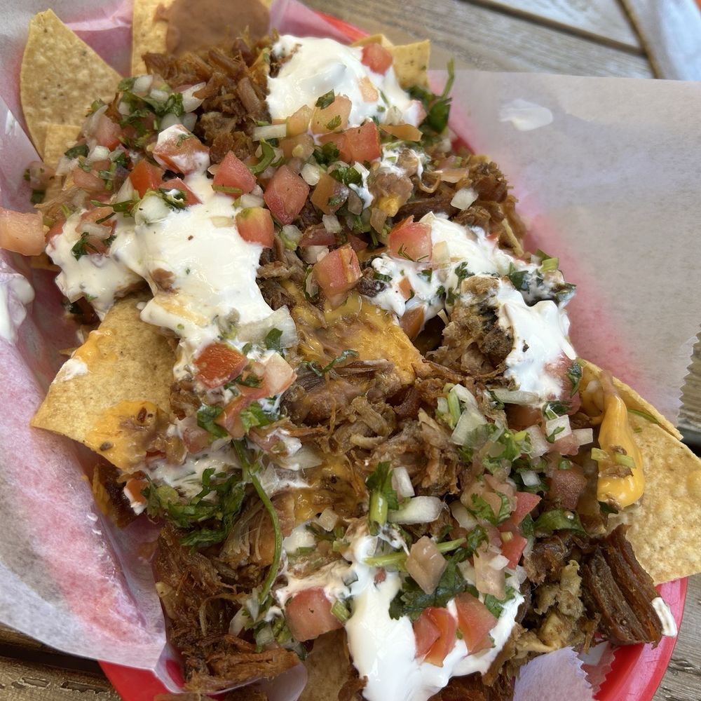 Super Carnitas Nachos with yellow cheese. Mmmmmmm Super Carnitas Nachos with yellow cheese. Mmmmmmm