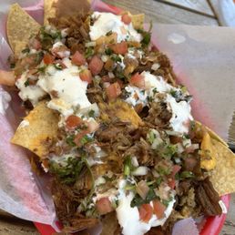 Super Carnitas Nachos with yellow cheese. Mmmmmmm Super Carnitas Nachos with yellow cheese. Mmmmmmm