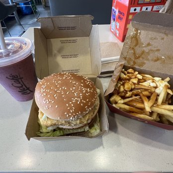 McDonald's - a hamburger and fries on a table - Fast Food Near Me - Calgary, Alberta McDonald's - a hamburger and fries on a table - Fast Food Near Me - Calgary, Alberta