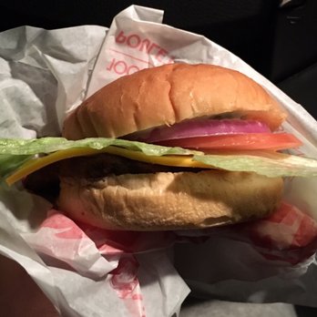Wendy's - a hamburger with lettuce, tomato, and cheese - Fast Food Near Me - North Vancouver, British Columbia