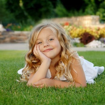 Western Irrigation & Landscape Management - a little girl laying in the grass - Landscaping Near Me - Cedar Park, Texas Western Irrigation & Landscape Management - a little girl laying in the grass - Landscaping Near Me - Cedar Park, Texas