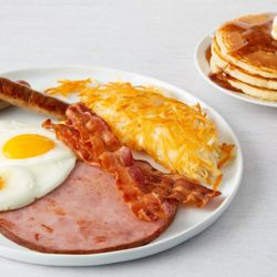 Village Inn - Signature 2-2-2 Breakfast! Two eggs, any style, two cherrywood-smoked bacon strips or two sausage links and two buttermilk pancakes.