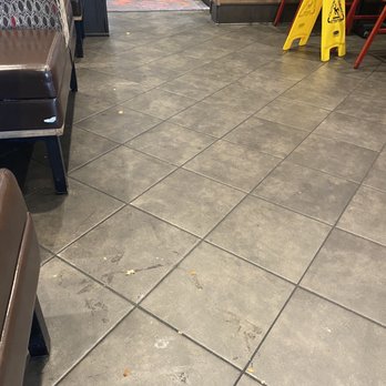 Chick-fil-A - ows a yellow caution sign in a restaurant - Fast Food Near Me - Panama City, Florida