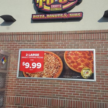 Casey's - a sign on the side of a pizza shop - Pizza Near Me - Osage Beach, Missouri Casey's - a sign on the side of a pizza shop - Pizza Near Me - Osage Beach, Missouri