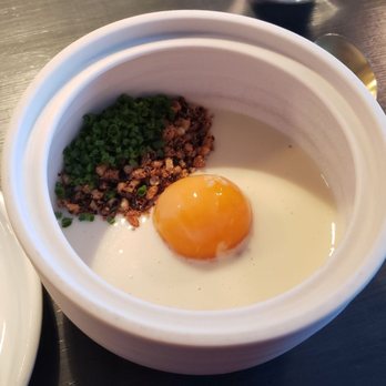 Commis - Slow poached eggs yolk, smoked dates, alliums, and malt - New American Near Me - Oakland, California Commis - Slow poached eggs yolk, smoked dates, alliums, and malt - New American Near Me - Oakland, California