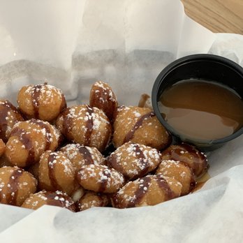 Red Door Brewing - a basket of doughnuts and a cup of coffee - Breweries Near Me - Clovis, New Mexico Red Door Brewing - a basket of doughnuts and a cup of coffee - Breweries Near Me - Clovis, New Mexico