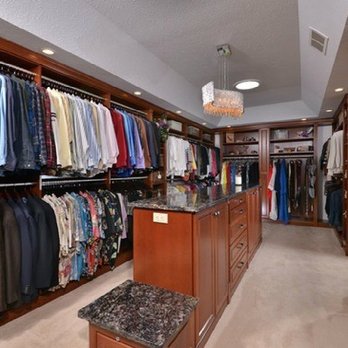 Tamer Construction - a walk - in closet with lots of clothes - General Contractors Near Me - Parma, Ohio