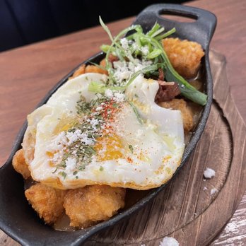 Kitchen Story - Tater tots with a fried egg and curry sauce - Breakfast & Brunch Near Me - Oakland, California Kitchen Story - Tater tots with a fried egg and curry sauce - Breakfast & Brunch Near Me - Oakland, California