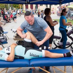 High Point Wellness Centre - Physiotherapist Zev Herskovits treating a cyclist at the Tour De Mississauga.