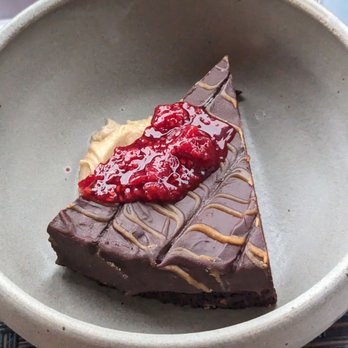 Restore Public House - Flourless chocolate torte with raspberry sauce - American Near Me - La Crosse, Wisconsin Restore Public House - Flourless chocolate torte with raspberry sauce - American Near Me - La Crosse, Wisconsin