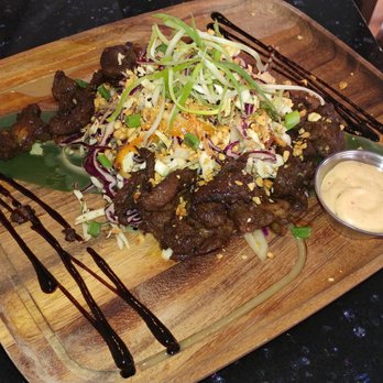 Poor Calvin's - Appetizer special: Beef jerky with papaya salad and peanuts - Asian Fusion Near Me - Atlanta, Georgia Poor Calvin's - Appetizer special: Beef jerky with papaya salad and peanuts - Asian Fusion Near Me - Atlanta, Georgia