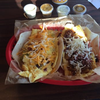 Torchy's Tacos - The Monk Special breakfast taco on the left. And, the Wrangler breakfast taco on the right. - Tex-Mex Near Me - Austin, Texas Torchy's Tacos - The Monk Special breakfast taco on the left. And, the Wrangler breakfast taco on the right. - Tex-Mex Near Me - Austin, Texas