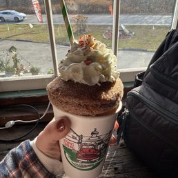 Spiked hot cider with apple cider donut topper