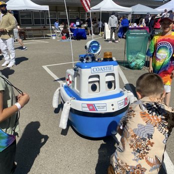 San Leandro Cherry Festival - Mini coast guard boat "entertaining" children. (Controlled by officer nearby) - Festivals Near Me - San Leandro, California