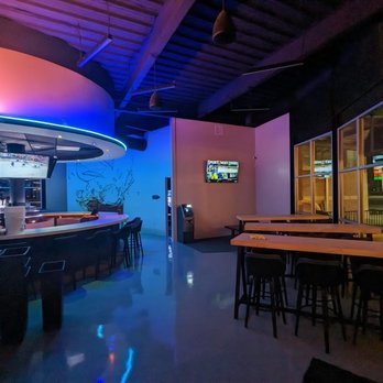 Rotunda Bar & Patio - a view of a bar and a television - Sports Bars Near Me - Jarrell, Texas