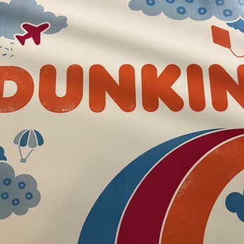 Dunkin' - a person holding up a sign - Donuts Near Me - Mayfield Heights, Ohio Dunkin' - a person holding up a sign - Donuts Near Me - Mayfield Heights, Ohio