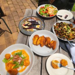 Wings, brussel sprouts, braised carrots, salad, and pimento bites