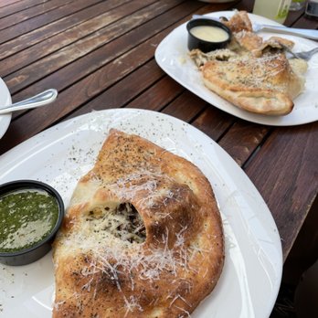 Sauce on the Side - a slice of pizza on a plate - Italian Near Me - Clayton, Missouri Sauce on the Side - a slice of pizza on a plate - Italian Near Me - Clayton, Missouri