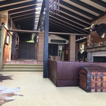 The Condor's Nest Ranch - Looking toward the front doors from a sitting room. Large fireplace (right) - Venues & Event Spaces Near Me - Pala, California The Condor's Nest Ranch - Looking toward the front doors from a sitting room. Large fireplace (right) - Venues & Event Spaces Near Me - Pala, California