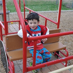 Lowry Montessori - Mile High Montessori Early Learning Centers - Playing on the playground at Lowry
