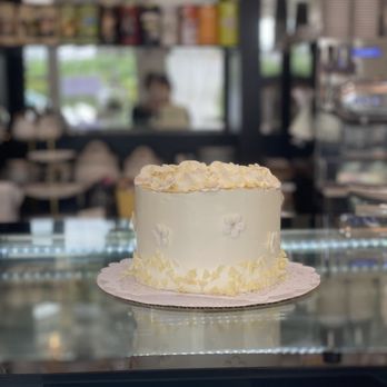 The Bakester - Gender Reveal Cake.  Neutral colors on the outside with colored icing (pink!) on the inside. - Coffee & Tea Near Me - Arlington Heights, Illinois