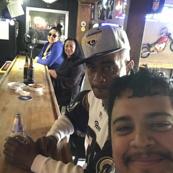 Smoke Wagon Saloon - a group of people sitting at a bar - Dive Bars Near Me - Victorville, California