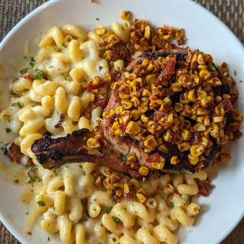 Cola's - Mexican Spiced Pork Chop with corn chutney and chipotle bacon Mac and cheese - New American Near Me - Columbia, South Carolina Cola's - Mexican Spiced Pork Chop with corn chutney and chipotle bacon Mac and cheese - New American Near Me - Columbia, South Carolina