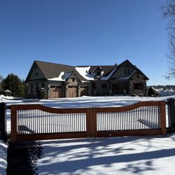 Champion Fence Builders - Aluminum Fence with automatic gate system.