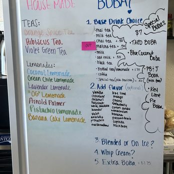 Taty - a white refrigerator with a list of items on it - Sandwiches Near Me - Angel Fire, New Mexico