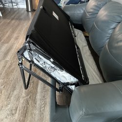 Hunter’s Furniture - Leather sofa bed.