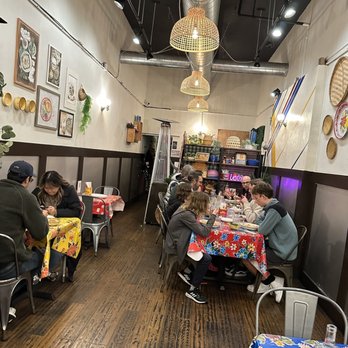 Pintoh Thai - people sitting at tables in a restaurant - Thai Near Me - Oakland, California