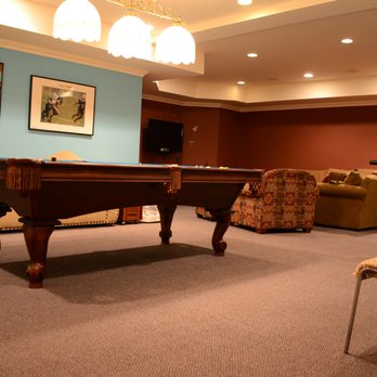 Floor Town - a pool table and chairs in a living room - Carpeting Near Me - Paramus, New Jersey
