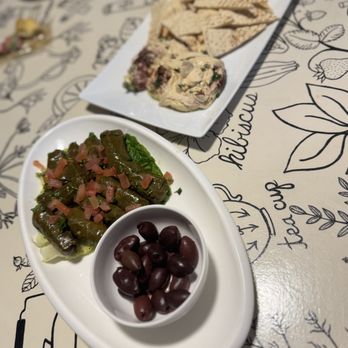 Yucca Kabob - Hummus & pita (toasted and sliced for serving) and grape leaves with smoked Kalamata olives (purchased separately from a different business) - Middle Eastern Near Me - Yucca Valley, California Yucca Kabob - Hummus & pita (toasted and sliced for serving) and grape leaves with smoked Kalamata olives (purchased separately from a different business) - Middle Eastern Near Me - Yucca Valley, California