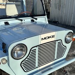 Luxury Car Wrap - Moke with custom racing stripe. Very well done.