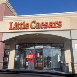 Little Caesars Pizza - The Hubby with the pizza