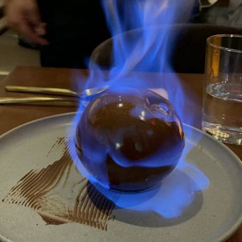 L'Ardente - Tiramisu Flambé on fire in the process of the chocolate melting. - Italian Near Me - Washington, DC, District of Columbia L'Ardente - Tiramisu Flambé on fire in the process of the chocolate melting. - Italian Near Me - Washington, DC, District of Columbia