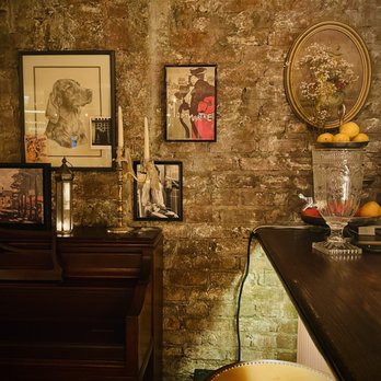 MaryLou - a brick wall with pictures on it - French Near Me - New York, New York