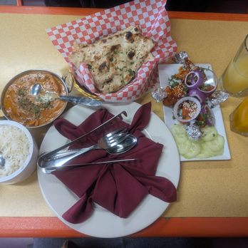 Sher E Punjab - Butter chicken with a side of rice, garlic naan, chicken lollipops, a mango juice & pineapple juice. - Indian Near Me - Fresno, California Sher E Punjab - Butter chicken with a side of rice, garlic naan, chicken lollipops, a mango juice & pineapple juice. - Indian Near Me - Fresno, California