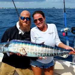 My Islands Adventure Charter Fishing and Snorkel Tours - Capt. Tim and first mate Ashley with a nice wahoo