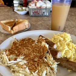 Dora Cafe - Breakfast Combo w/ Sausage Links, Hash browns, toast and OJ...delicious!