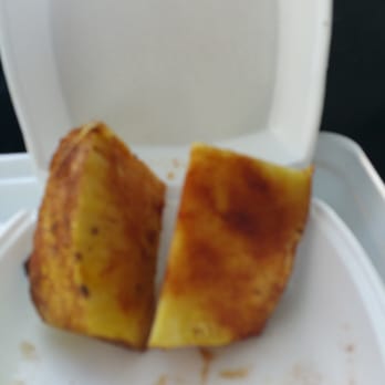 Tudo Na Brasa - A couple pieces of Pineapple topped with cinnamon - Brazilian Near Me - Woburn, Massachusetts