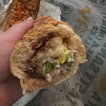 Subway - a hand holding a half eaten sandwich - Sandwiches Near Me - Halletsville, Texas Subway - a hand holding a half eaten sandwich - Sandwiches Near Me - Halletsville, Texas