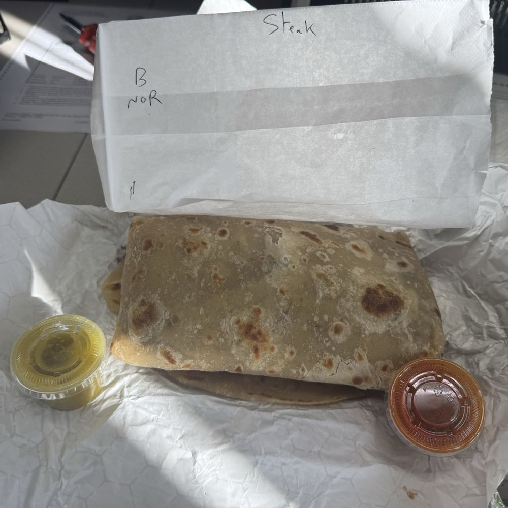 Asada Steak Onion Burritos with the red and green sauce. I prefer the green. Asada Steak Onion Burritos with the red and green sauce. I prefer the green.