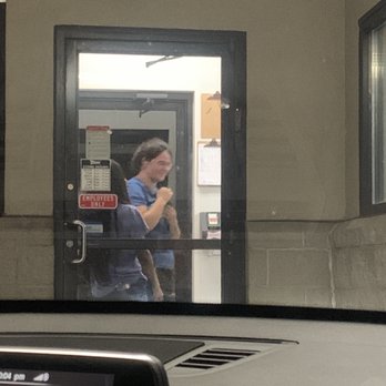 Sonic Drive-In - Employees having a conversation while playing with a CAT, while there's at least 8 cars waiting to pick up food or place order. - Burgers Near Me - Columbus, Ohio