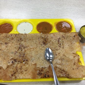Madras Cafe - a plate of dosa with a spoon and condiments - Indian Near Me - Calgary, Alberta Madras Cafe - a plate of dosa with a spoon and condiments - Indian Near Me - Calgary, Alberta
